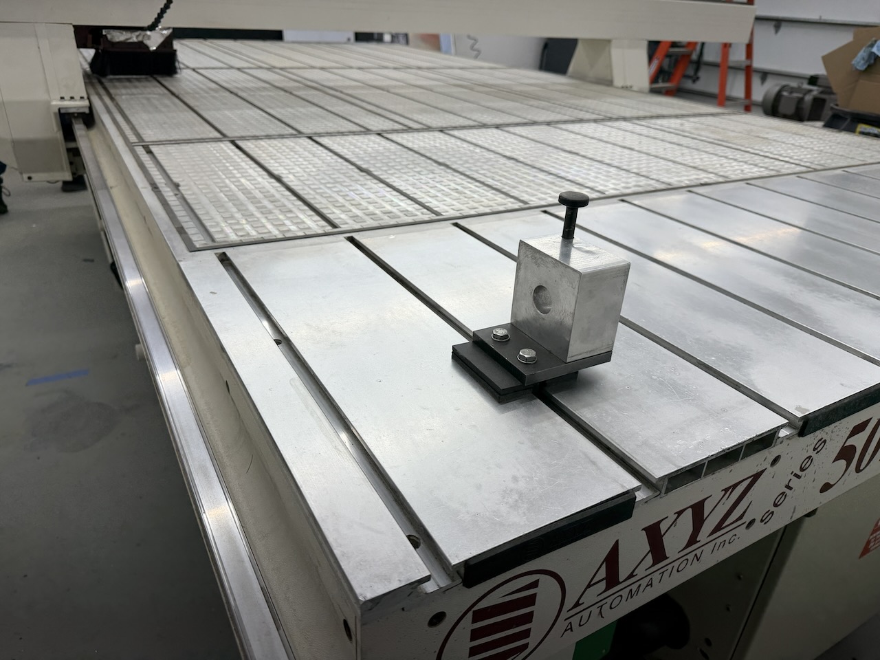 Aluminum T-slot table rails and vacuum grid inserts